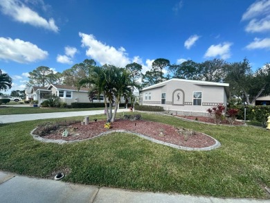 Lot Rent $1342.00 monthly  Beautiful stucco home located on a on Del Tura Golf and Country Club in Florida - for sale on GolfHomes.com, golf home, golf lot
