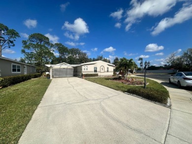 Lot Rent $1342.00 monthly  Beautiful stucco home located on a on Del Tura Golf and Country Club in Florida - for sale on GolfHomes.com, golf home, golf lot