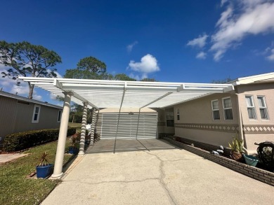 Lot Rent $1342.00 monthly  Beautiful stucco home located on a on Del Tura Golf and Country Club in Florida - for sale on GolfHomes.com, golf home, golf lot