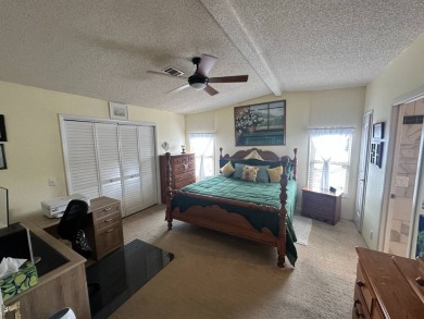 Lot Rent $1342.00 monthly  Beautiful stucco home located on a on Del Tura Golf and Country Club in Florida - for sale on GolfHomes.com, golf home, golf lot