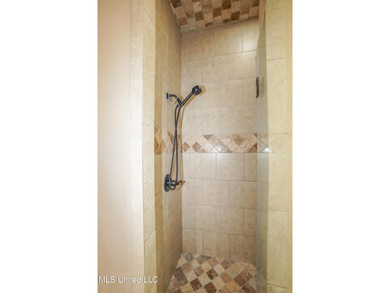 This stunning Lake Caroline waterfront home offers the perfect on Lake Caroline Golf Club in Mississippi - for sale on GolfHomes.com, golf home, golf lot