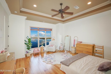 This stunning Lake Caroline waterfront home offers the perfect on Lake Caroline Golf Club in Mississippi - for sale on GolfHomes.com, golf home, golf lot