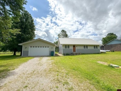 Just steps from the White River, this custom-built 2-bedroom on Rivercliff Golf Course in Arkansas - for sale on GolfHomes.com, golf home, golf lot