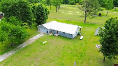 Just steps from the White River, this custom-built 2-bedroom on Rivercliff Golf Course in Arkansas - for sale on GolfHomes.com, golf home, golf lot