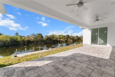 WATERFRONT NEW CONSTRUCTION HOME comes loaded with upgrades on Coral Oaks Golf Course in Florida - for sale on GolfHomes.com, golf home, golf lot