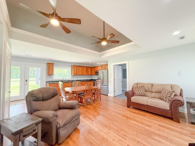 Just steps from the White River, this custom-built 2-bedroom on Rivercliff Golf Course in Arkansas - for sale on GolfHomes.com, golf home, golf lot