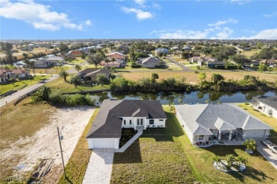 WATERFRONT NEW CONSTRUCTION HOME comes loaded with upgrades on Coral Oaks Golf Course in Florida - for sale on GolfHomes.com, golf home, golf lot