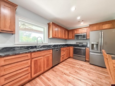Just steps from the White River, this custom-built 2-bedroom on Rivercliff Golf Course in Arkansas - for sale on GolfHomes.com, golf home, golf lot