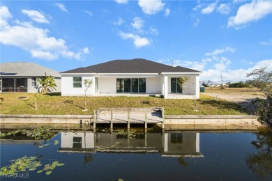 WATERFRONT NEW CONSTRUCTION HOME comes loaded with upgrades on Coral Oaks Golf Course in Florida - for sale on GolfHomes.com, golf home, golf lot