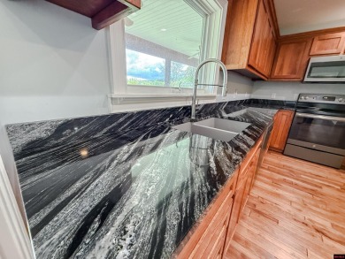 Just steps from the White River, this custom-built 2-bedroom on Rivercliff Golf Course in Arkansas - for sale on GolfHomes.com, golf home, golf lot