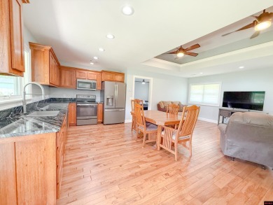 Just steps from the White River, this custom-built 2-bedroom on Rivercliff Golf Course in Arkansas - for sale on GolfHomes.com, golf home, golf lot