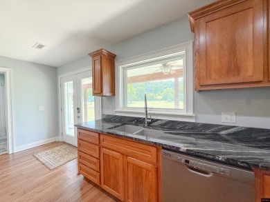Just steps from the White River, this custom-built 2-bedroom on Rivercliff Golf Course in Arkansas - for sale on GolfHomes.com, golf home, golf lot