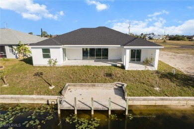 WATERFRONT NEW CONSTRUCTION HOME comes loaded with upgrades on Coral Oaks Golf Course in Florida - for sale on GolfHomes.com, golf home, golf lot