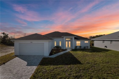 WATERFRONT NEW CONSTRUCTION HOME comes loaded with upgrades on Coral Oaks Golf Course in Florida - for sale on GolfHomes.com, golf home, golf lot