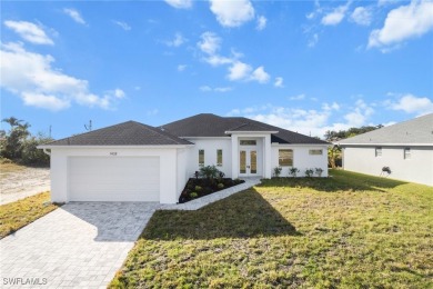 WATERFRONT NEW CONSTRUCTION HOME comes loaded with upgrades on Coral Oaks Golf Course in Florida - for sale on GolfHomes.com, golf home, golf lot