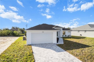 WATERFRONT NEW CONSTRUCTION HOME comes loaded with upgrades on Coral Oaks Golf Course in Florida - for sale on GolfHomes.com, golf home, golf lot