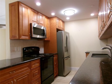 This is a stunning 1 bedroom 1.5 bath unit located on the first on Wynmoor Golf Course in Florida - for sale on GolfHomes.com, golf home, golf lot