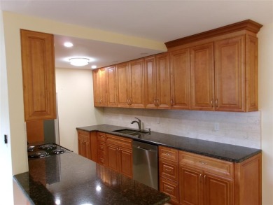 This is a stunning 1 bedroom 1.5 bath unit located on the first on Wynmoor Golf Course in Florida - for sale on GolfHomes.com, golf home, golf lot