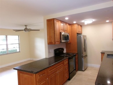 This is a stunning 1 bedroom 1.5 bath unit located on the first on Wynmoor Golf Course in Florida - for sale on GolfHomes.com, golf home, golf lot