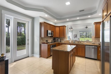 Experience luxury living in this desirable ground-floor Golf on Regatta Bay Golf and Country Club in Florida - for sale on GolfHomes.com, golf home, golf lot