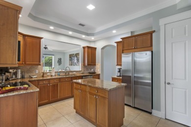 Experience luxury living in this desirable ground-floor Golf on Regatta Bay Golf and Country Club in Florida - for sale on GolfHomes.com, golf home, golf lot