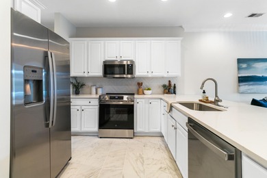 Enjoy $70K+ of recent upgrades in this bright, airy townhome on Charleston National Golf Club in South Carolina - for sale on GolfHomes.com, golf home, golf lot