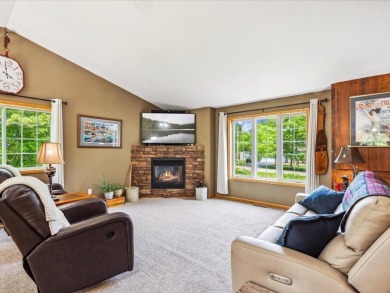 Nestled on a tranquil dead-end road, this stunning four-bedroom on Deacons Lodge Golf Course in Minnesota - for sale on GolfHomes.com, golf home, golf lot