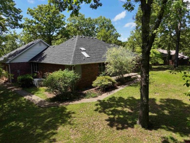 Discover this all-brick gem in the Oaks subdivision, perfectly on Twin Lakes Golf Club in Arkansas - for sale on GolfHomes.com, golf home, golf lot