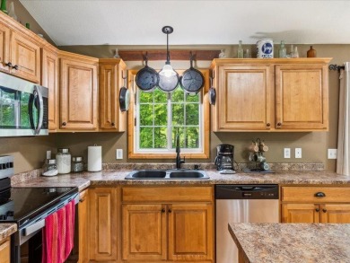 Nestled on a tranquil dead-end road, this stunning four-bedroom on Deacons Lodge Golf Course in Minnesota - for sale on GolfHomes.com, golf home, golf lot