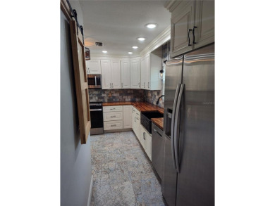 PRICE IMPROVEMENT!!!!You will love this spacious end unit on The Dunedin Country Club in Florida - for sale on GolfHomes.com, golf home, golf lot