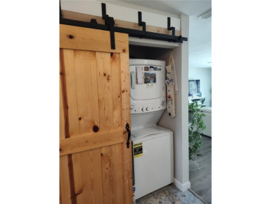 PRICE IMPROVEMENT!!!!You will love this spacious end unit on The Dunedin Country Club in Florida - for sale on GolfHomes.com, golf home, golf lot