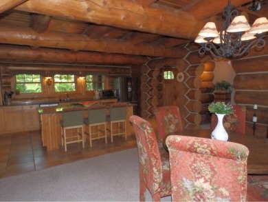 Amazing fully furnished log home on the 6th tee of Garland's on Garland Resort and Golf Club  in Michigan - for sale on GolfHomes.com, golf home, golf lot