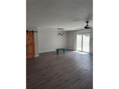 PRICE IMPROVEMENT!!!!You will love this spacious end unit on The Dunedin Country Club in Florida - for sale on GolfHomes.com, golf home, golf lot