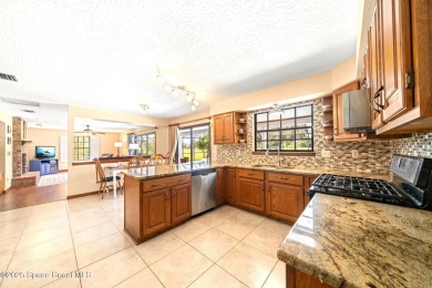 Outstanding, updated golf course home offering unmatched luxury on Suntree Country Club in Florida - for sale on GolfHomes.com, golf home, golf lot