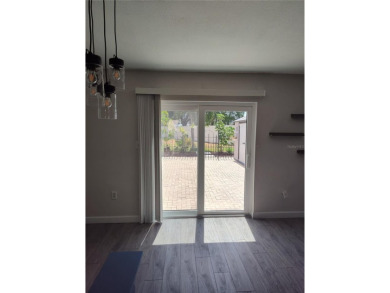 PRICE IMPROVEMENT!!!!You will love this spacious end unit on The Dunedin Country Club in Florida - for sale on GolfHomes.com, golf home, golf lot