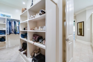 Nestled in the prestigious gated community of Le Triomphe Golf & on LeTriomphe Golf and Country Club in Louisiana - for sale on GolfHomes.com, golf home, golf lot
