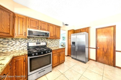 Outstanding, updated golf course home offering unmatched luxury on Suntree Country Club in Florida - for sale on GolfHomes.com, golf home, golf lot