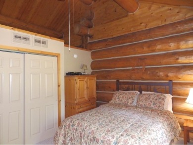 Amazing fully furnished log home on the 6th tee of Garland's on Garland Resort and Golf Club  in Michigan - for sale on GolfHomes.com, golf home, golf lot