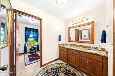 Outstanding, updated golf course home offering unmatched luxury on Suntree Country Club in Florida - for sale on GolfHomes.com, golf home, golf lot