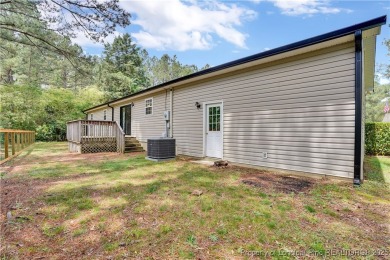 Opportunity doesn't knock-it shows up with curb appeal, fresh on Woodlake Country Club in North Carolina - for sale on GolfHomes.com, golf home, golf lot