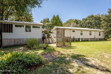 Location is everything! Bring the golf cart! Perfect for great on Gulf Hills Golf Club in Mississippi - for sale on GolfHomes.com, golf home, golf lot