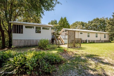 Location is everything! Bring the golf cart! Perfect for great on Gulf Hills Golf Club in Mississippi - for sale on GolfHomes.com, golf home, golf lot