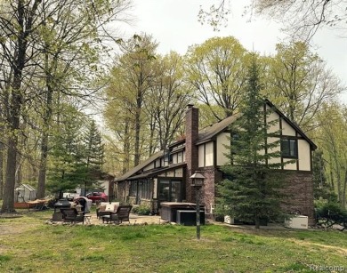 Welcome to this charming English Tudor home, nestled in tranquil on River Bank Golf Course in Michigan - for sale on GolfHomes.com, golf home, golf lot
