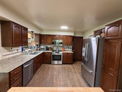 Welcome to this charming English Tudor home, nestled in tranquil on River Bank Golf Course in Michigan - for sale on GolfHomes.com, golf home, golf lot