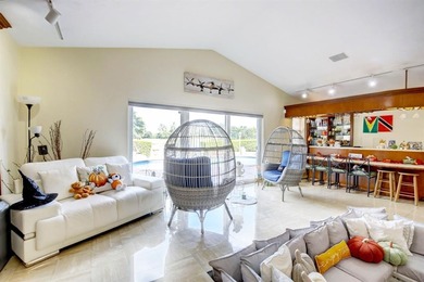 RARELY AVAILABLE POOL, LAKE  and GOLF COURSE views from this on Jacaranda Golf Club in Florida - for sale on GolfHomes.com, golf home, golf lot