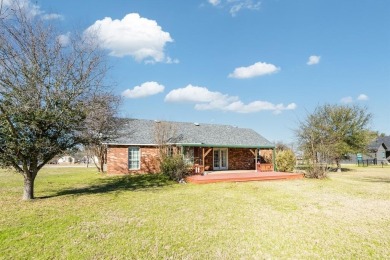 Located just a few blocks from a scenic 9-hole golf course, this on Star Harbor Golf Club in Texas - for sale on GolfHomes.com, golf home, golf lot