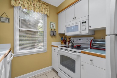 Tucked inside the gated, tree-lined entrance of Pawleys on Pawleys Plantation Golf and Country Club in South Carolina - for sale on GolfHomes.com, golf home, golf lot