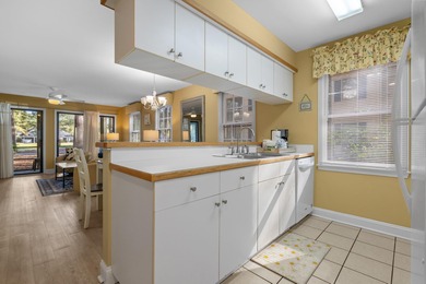 Tucked inside the gated, tree-lined entrance of Pawleys on Pawleys Plantation Golf and Country Club in South Carolina - for sale on GolfHomes.com, golf home, golf lot