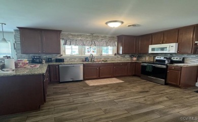 Situated on 2.69 acres of a well-manicured lot complete with a on Mill Quarter Plantation Country Club in Virginia - for sale on GolfHomes.com, golf home, golf lot