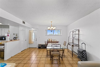 Beautifully maintained top-floor unit in sought-after Hollybrook on Hollybrook Golf and Tennis Club  in Florida - for sale on GolfHomes.com, golf home, golf lot